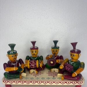 four people playing drums